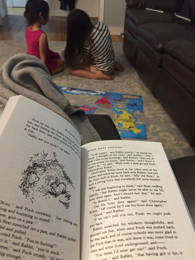 mom reads aloud while kids keep their hands busy with a puzzle and listen